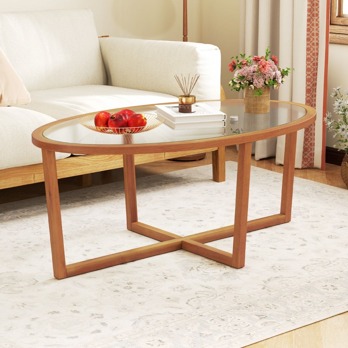 Couchtisch „Coast“ – ovales Hartglas – Kreuzfuß aus Akazienholz – braun – 118 x 71,5 x 47,5 cm