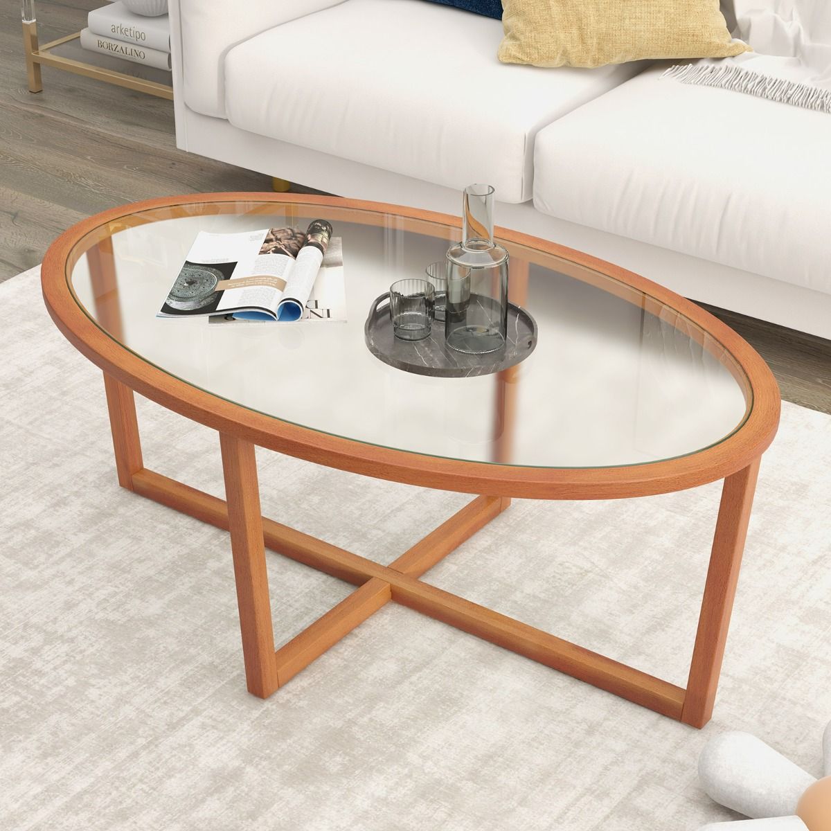 Couchtisch „Coast“ – ovales Hartglas – Kreuzfuß aus Akazienholz – braun – 118 x 71,5 x 47,5 cm