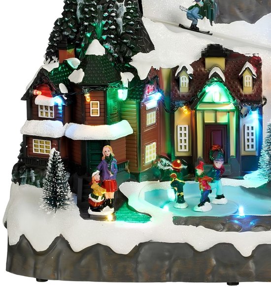 Luville Weihnachtsdorf – Miniatur-Dorfplatz – Weihnachtsdekoration mit Schlittschuh laufenden Bewohnern – Weihnachtsdekoration mit LED-Beleuchtung und sich drehenden Figuren – L 34 x B 18 x H 24 cm – Weiß